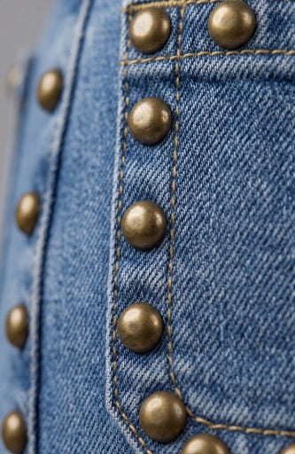 Liverpool Jeans Hannah flare bottoms with patch pockets and stud accents, showcasing a stylish, fitted design with a slight flare.