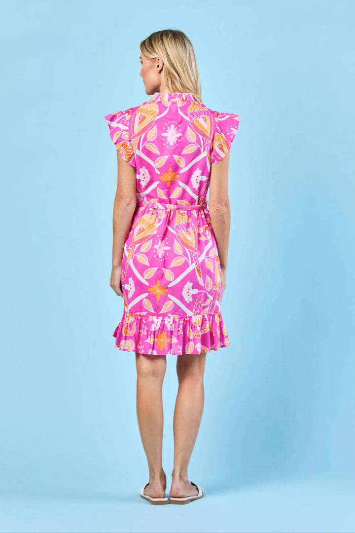 Miller Magenta Paradise Dress by SHERIDAN FRENCH DESIGNS, vibrant pink dress with floral patterns, displayed on a hanger.