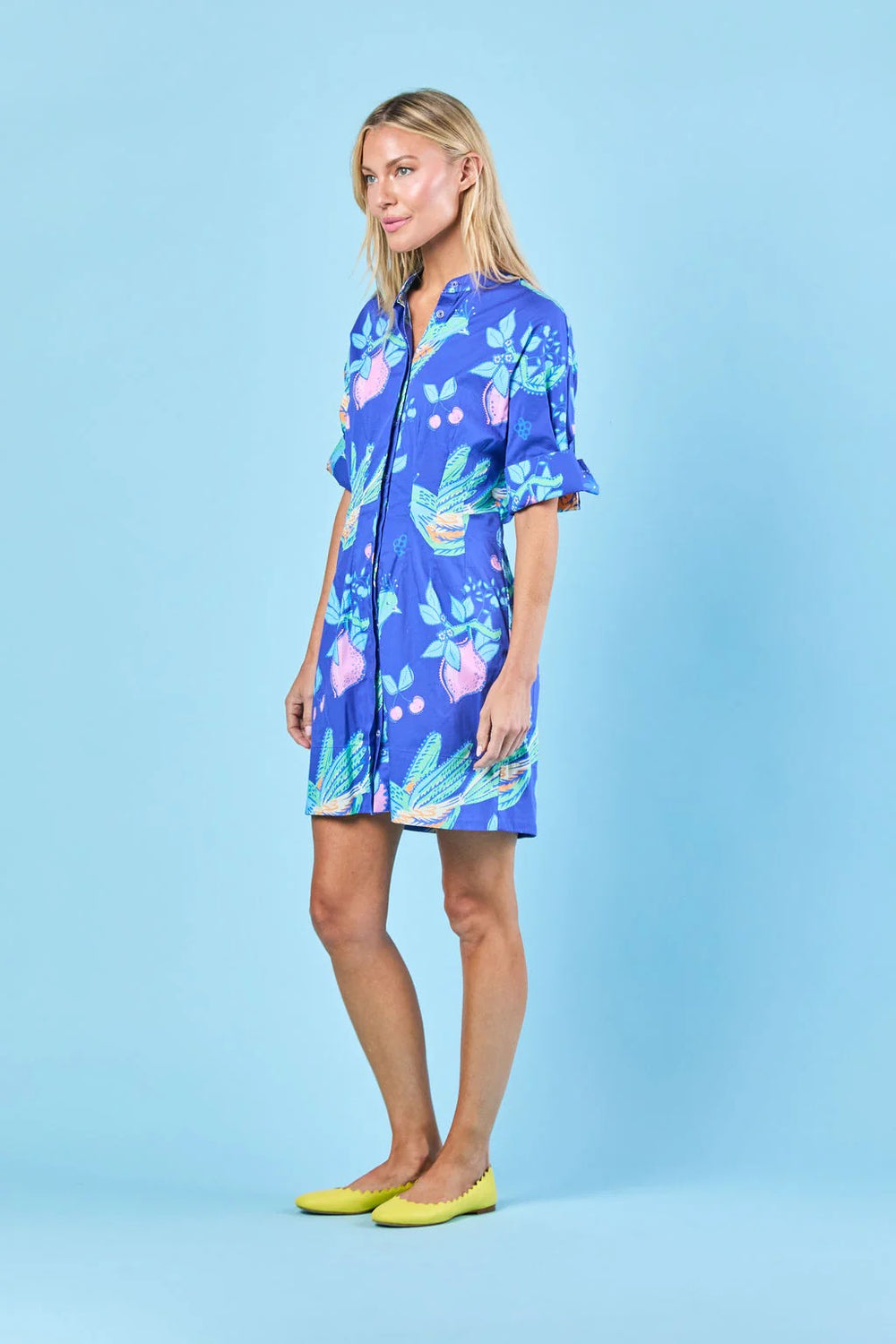 Sheridan French Parker Songbird Dress displayed on a hanger, showcasing its vibrant floral pattern and elegant design.