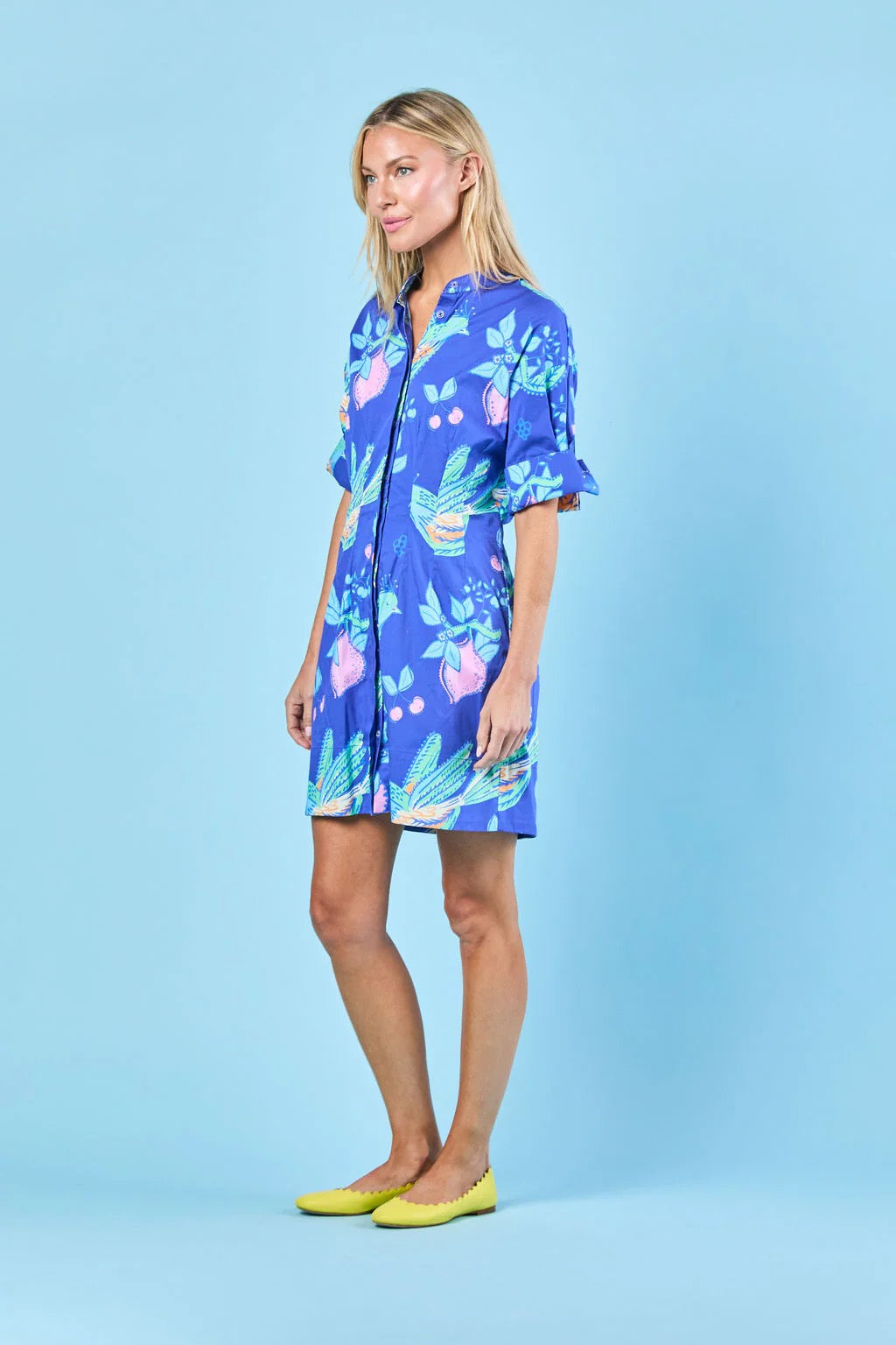 Sheridan French Parker Songbird Dress displayed on a hanger, showcasing its vibrant floral pattern and elegant design.