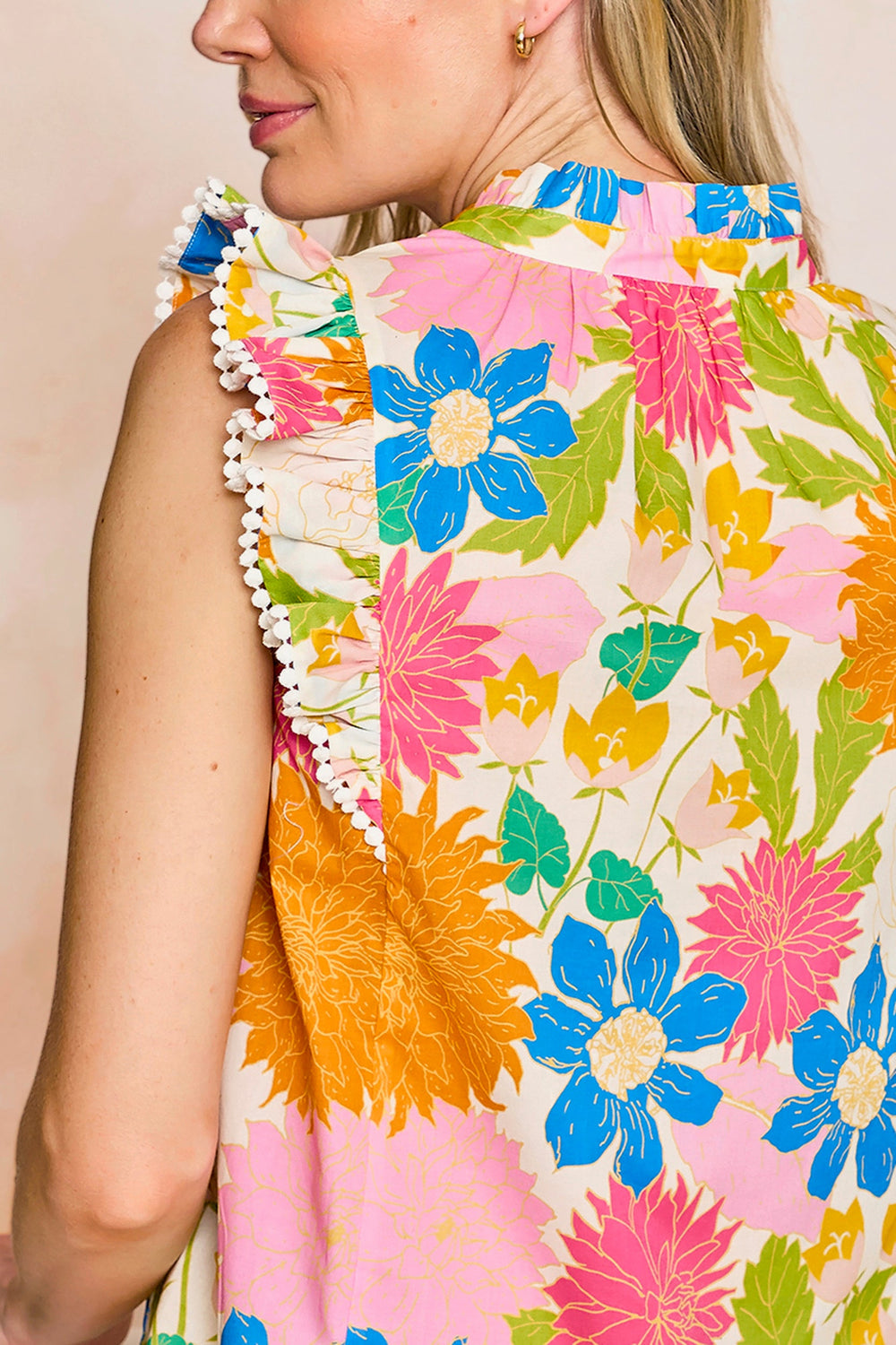 Sheridan French Georgia Sunshine Meadow blouse, a stylish women's top with floral print and lightweight fabric, displayed on a hanger.