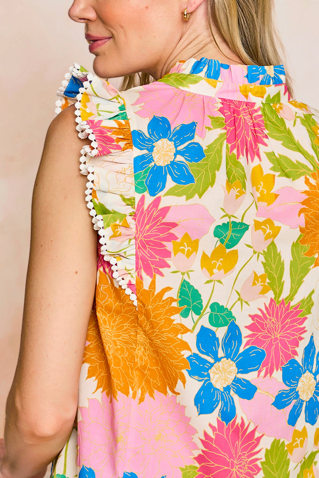 Sheridan French Georgia Sunshine Meadow blouse, a stylish women's top with floral print and lightweight fabric, displayed on a hanger.