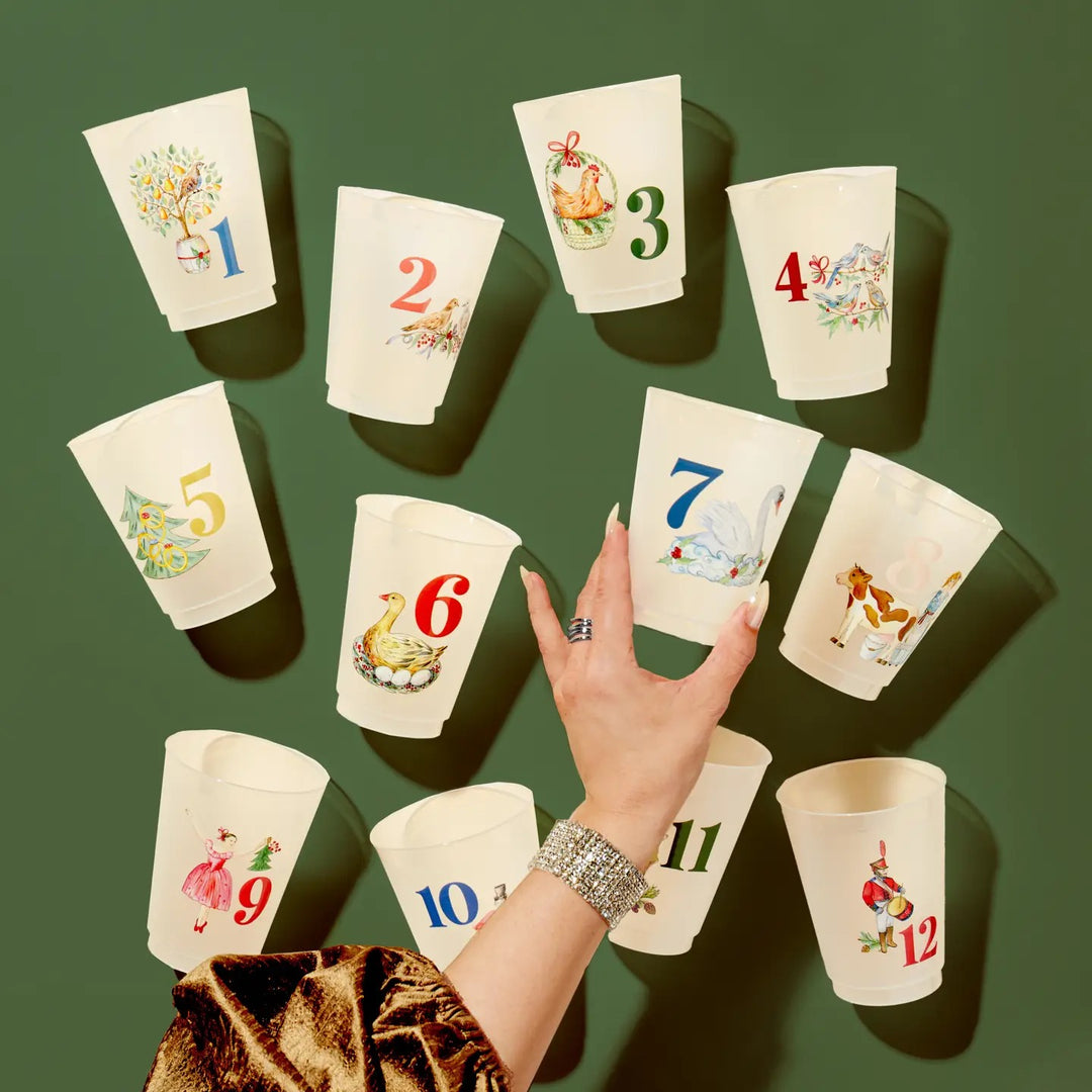 Frosted 12 Days of Christmas cups from Sip Sip Hooray, festive holiday-themed home drinkware with colorful designs.