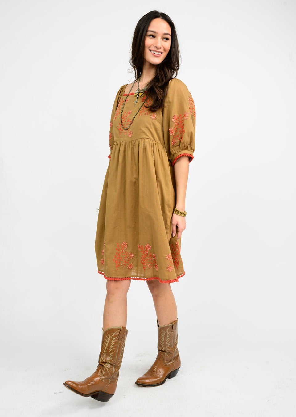Sister Mary Bernice copper dress featuring a stylish, flowing design with intricate details and a flattering fit.
