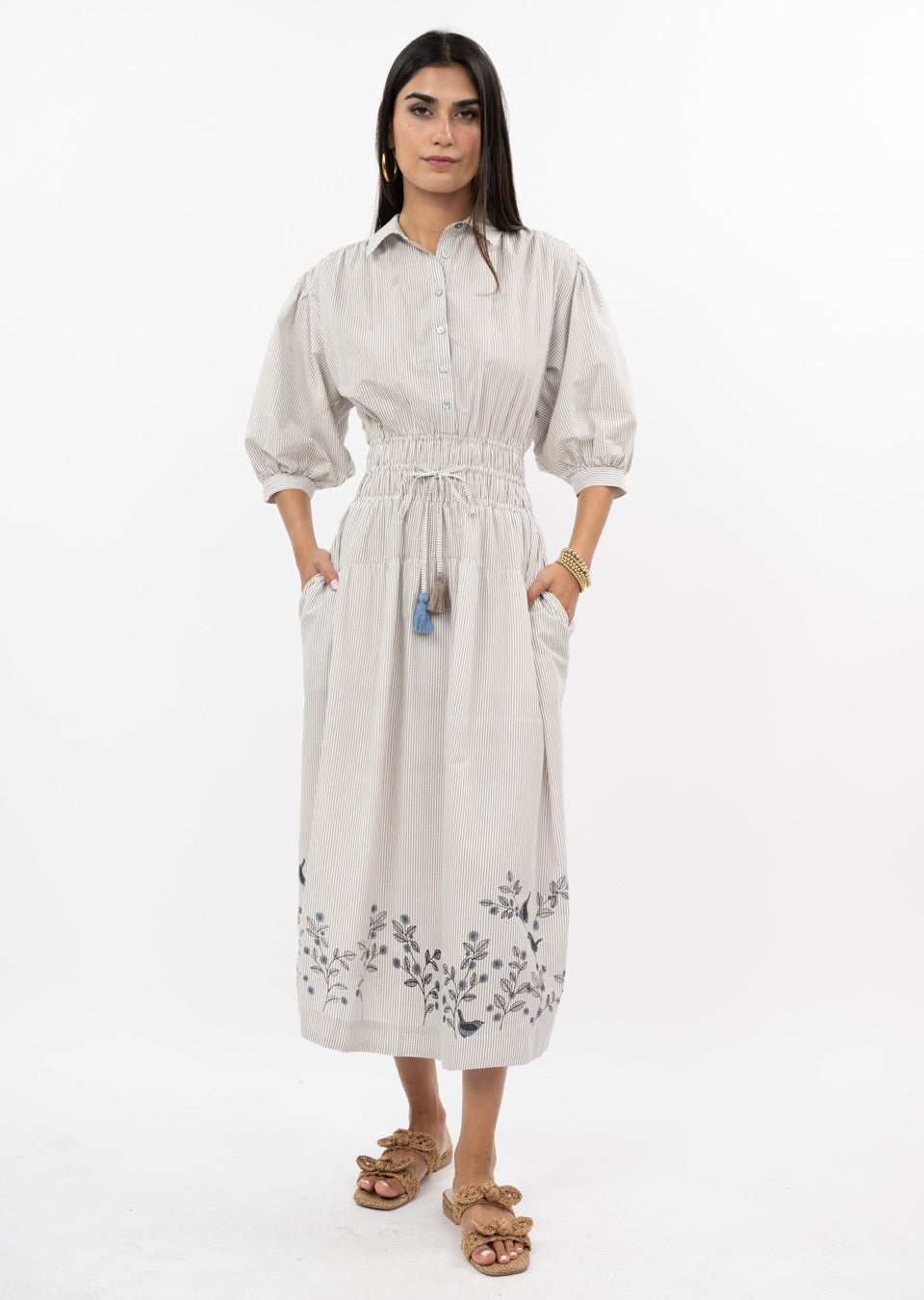Sister Mary Bird On A Wire dress featuring a colorful bird pattern on a stylish, fitted dress with a round neckline.
