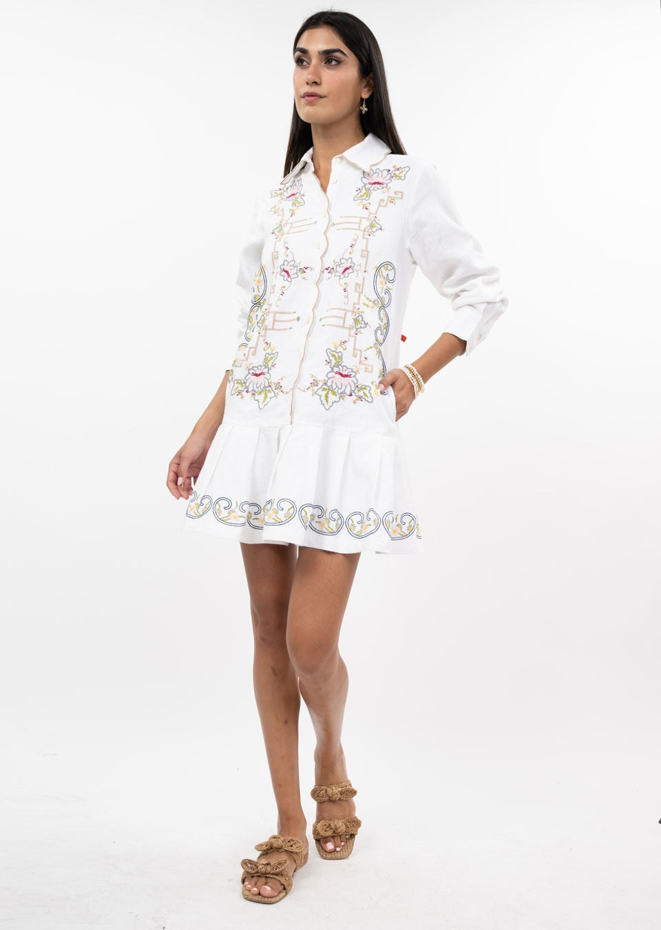 Embroidered linen dress by Sister Mary featuring intricate embroidery, lightweight fabric, and a relaxed fit.