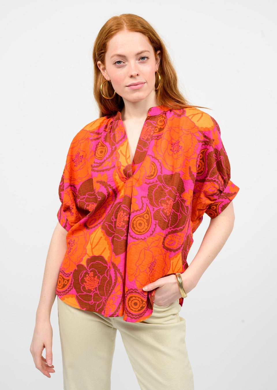 Sister Mary flower popover top with a floral pattern, lightweight fabric, and relaxed fit, shown on a model.
