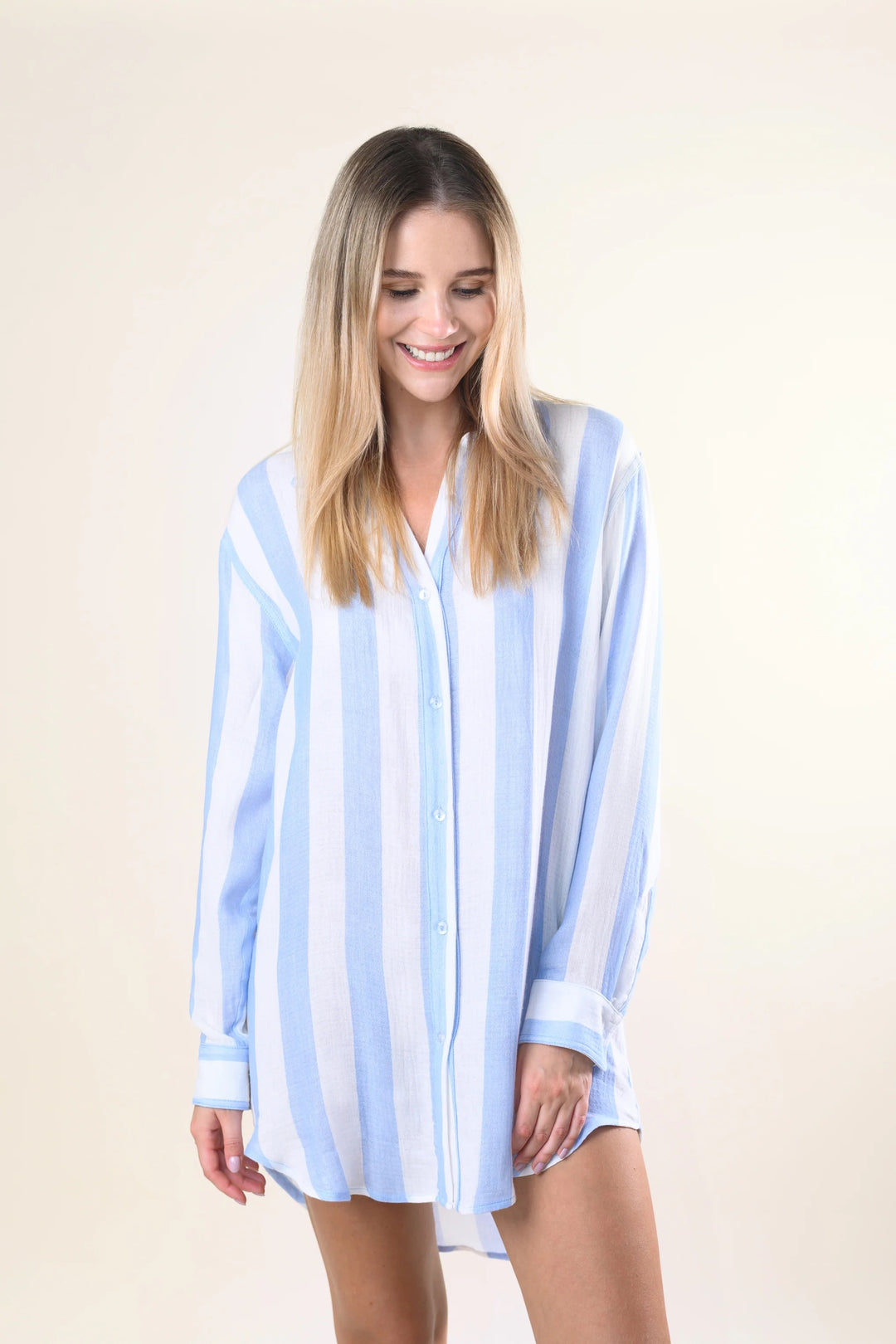 Sitano Positano striped shirtdress displayed on a hanger, featuring blue and white horizontal stripes and a classic button-down design.