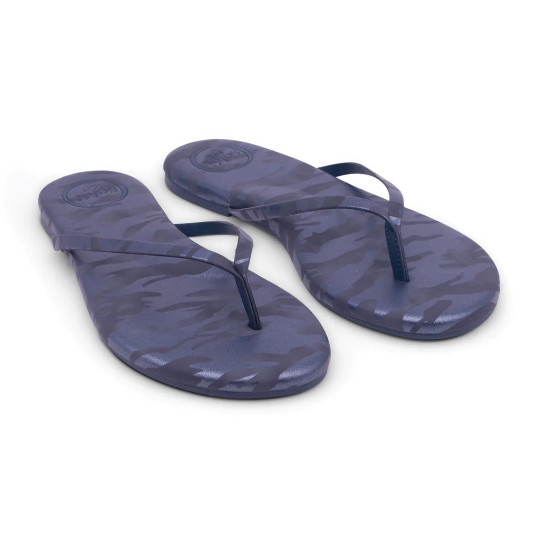 Close-up of Solei Sandals accessories with intricate strap design and neutral color, showcasing stylish footwear details.