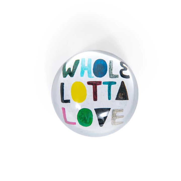 Round paperweight from Sugarboo Designs, 4x4 inches, decorative gift item with artistic design and smooth surface.