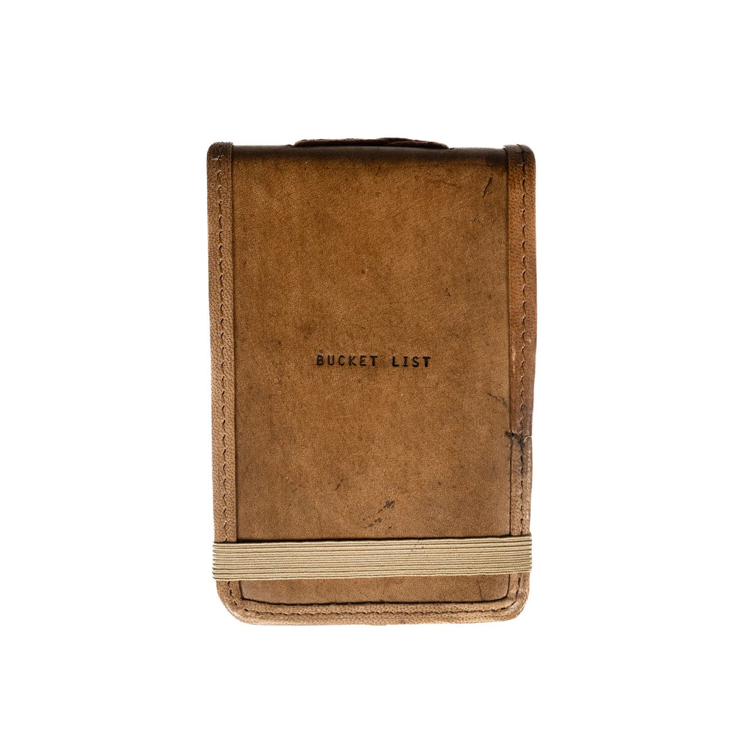 Mini leather journal from Sugarboo Designs, featuring a rustic cover and compact size, ideal for gifts and personal notes.