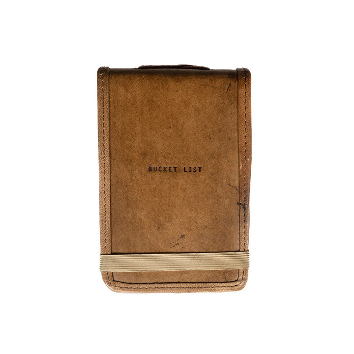 Mini leather journal from Sugarboo Designs, featuring a rustic cover and compact size, ideal for gifts and personal notes.