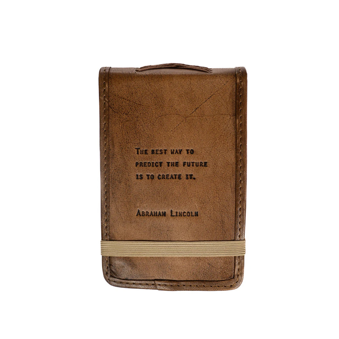 Mini leather journal by Sugarboo Designs with a rustic cover, perfect for gifts or personal writing.