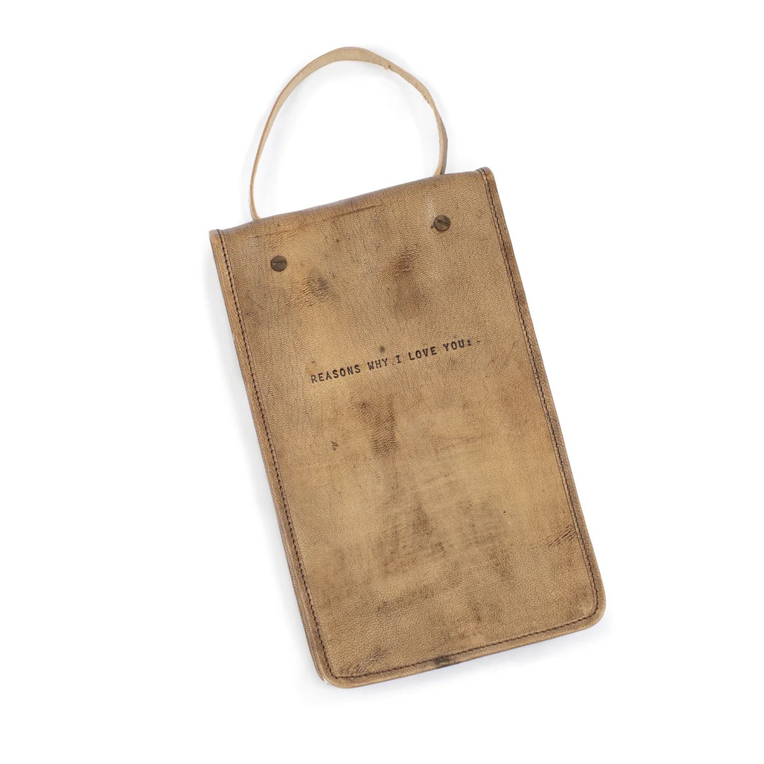 Hanging leather journal by sugarboo Designs featuring rustic design and durable leather cover, perfect for gifts and personal use.