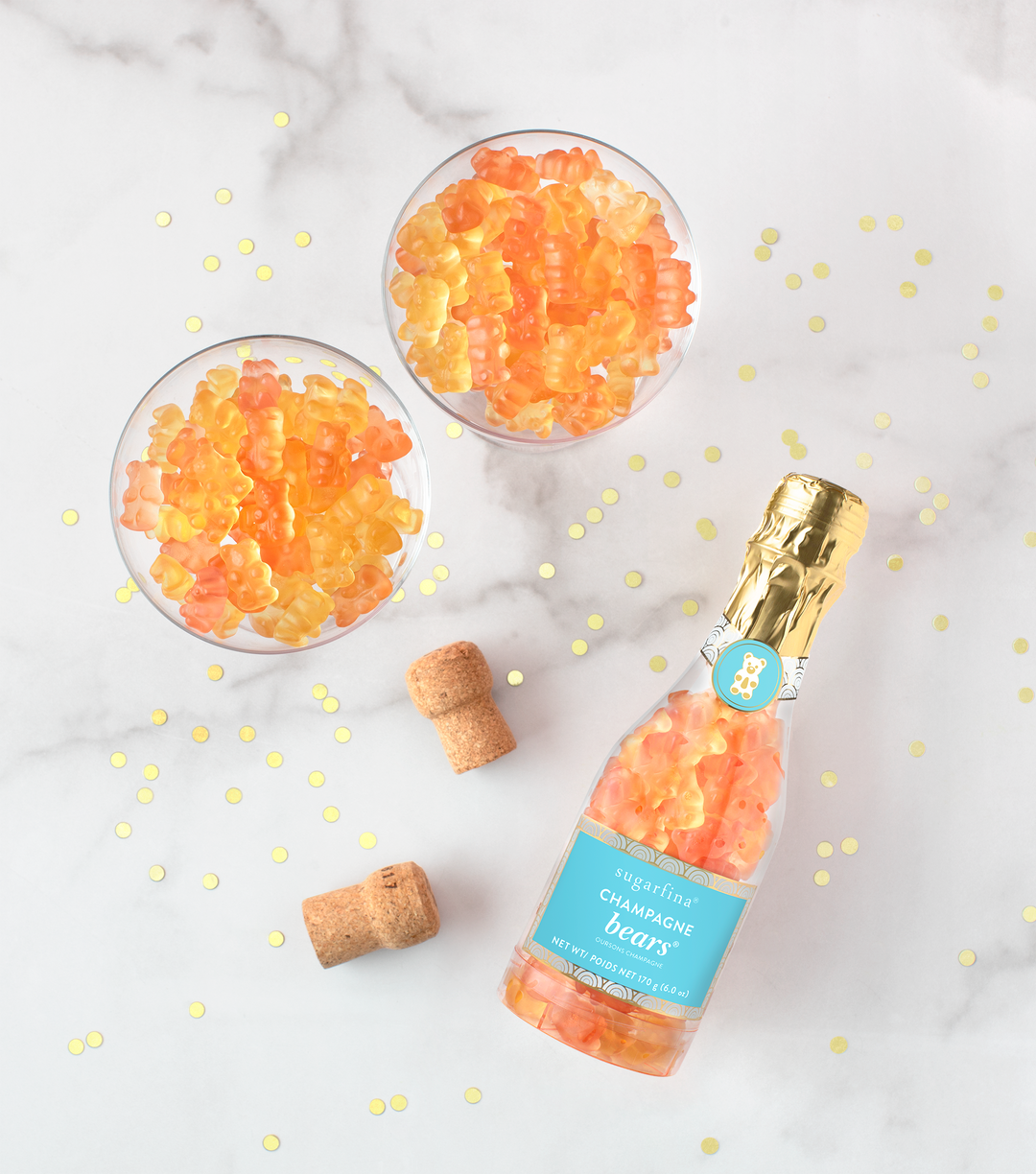 Sugarfina Champagne Bears Celebration Bottle gift box with colorful bear-shaped candies inside a clear display container.