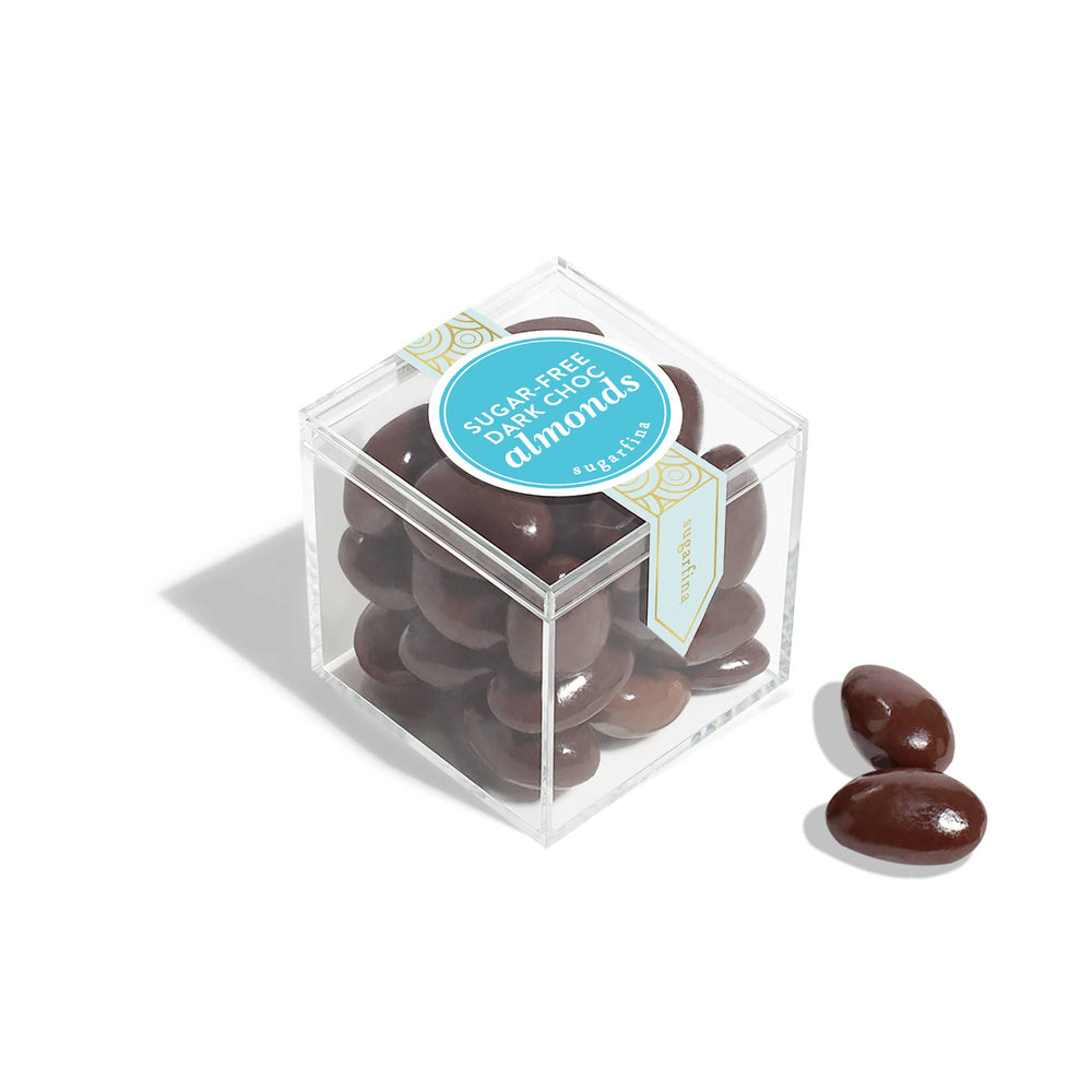 Small gift box of Sugarfina sugar-free dark chocolate almonds, featuring a close-up of the elegant packaging and almonds inside.