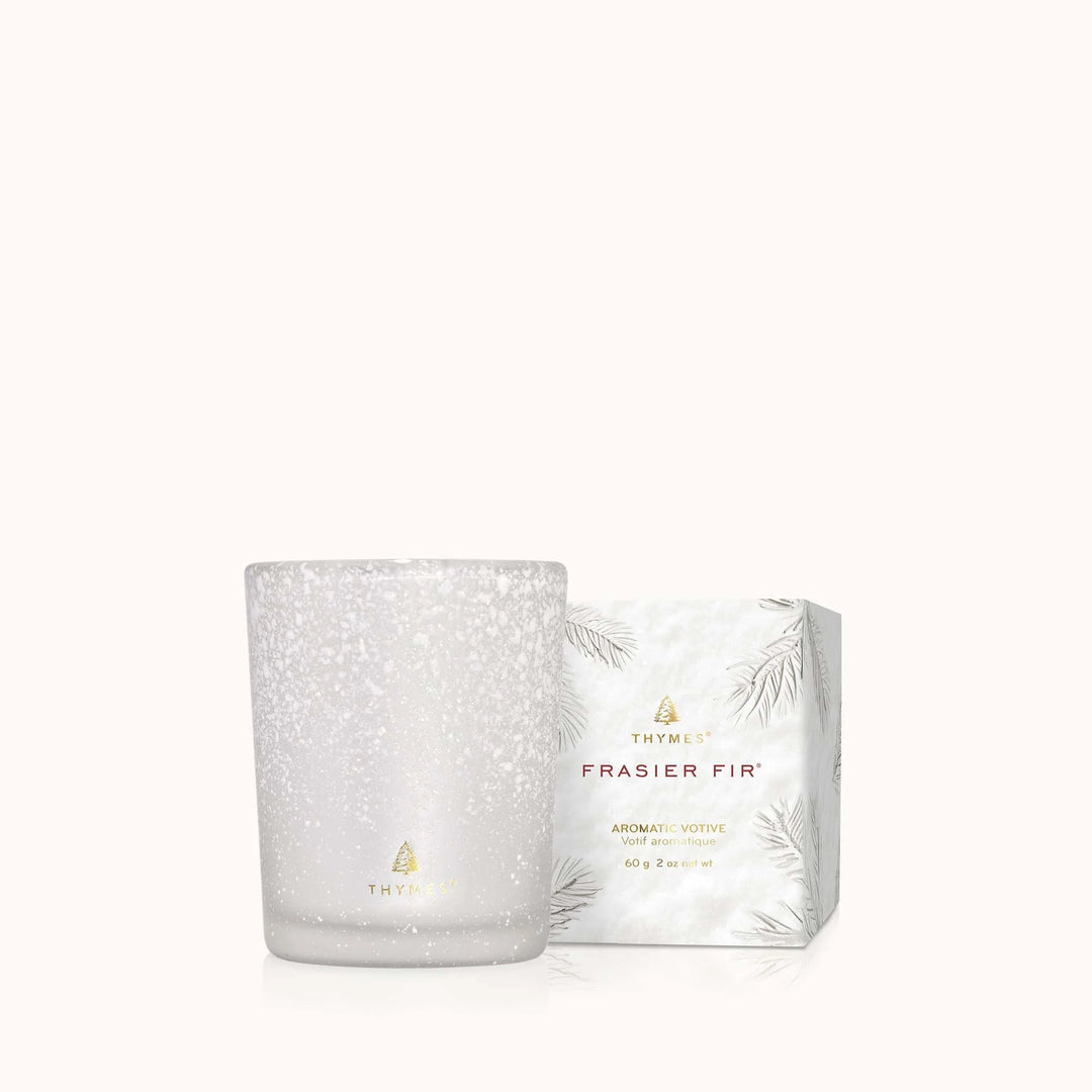Flocked Fir Votive Candle from Thymes, showcasing a cozy, winter-themed home decor candle with a flocked fir design.