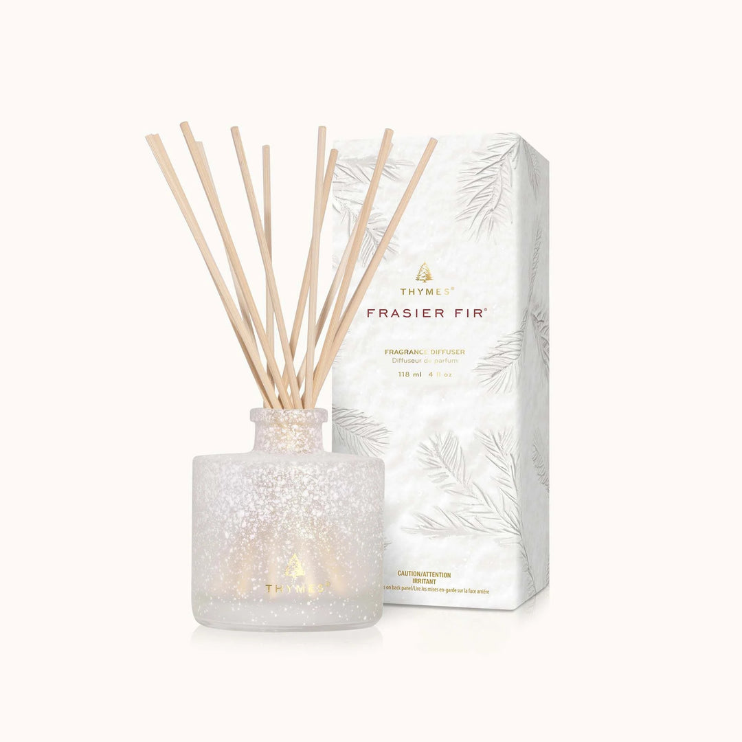 Flocked petite diffuser from Thymes, a sleek home fragrance diffuser with decorative flocked design and reed sticks for scent.