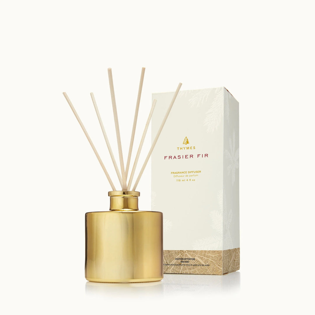 Petite gold Thymes home diffuser with a sleek, modern design and a small glass container, perfect for aromatic home décor.