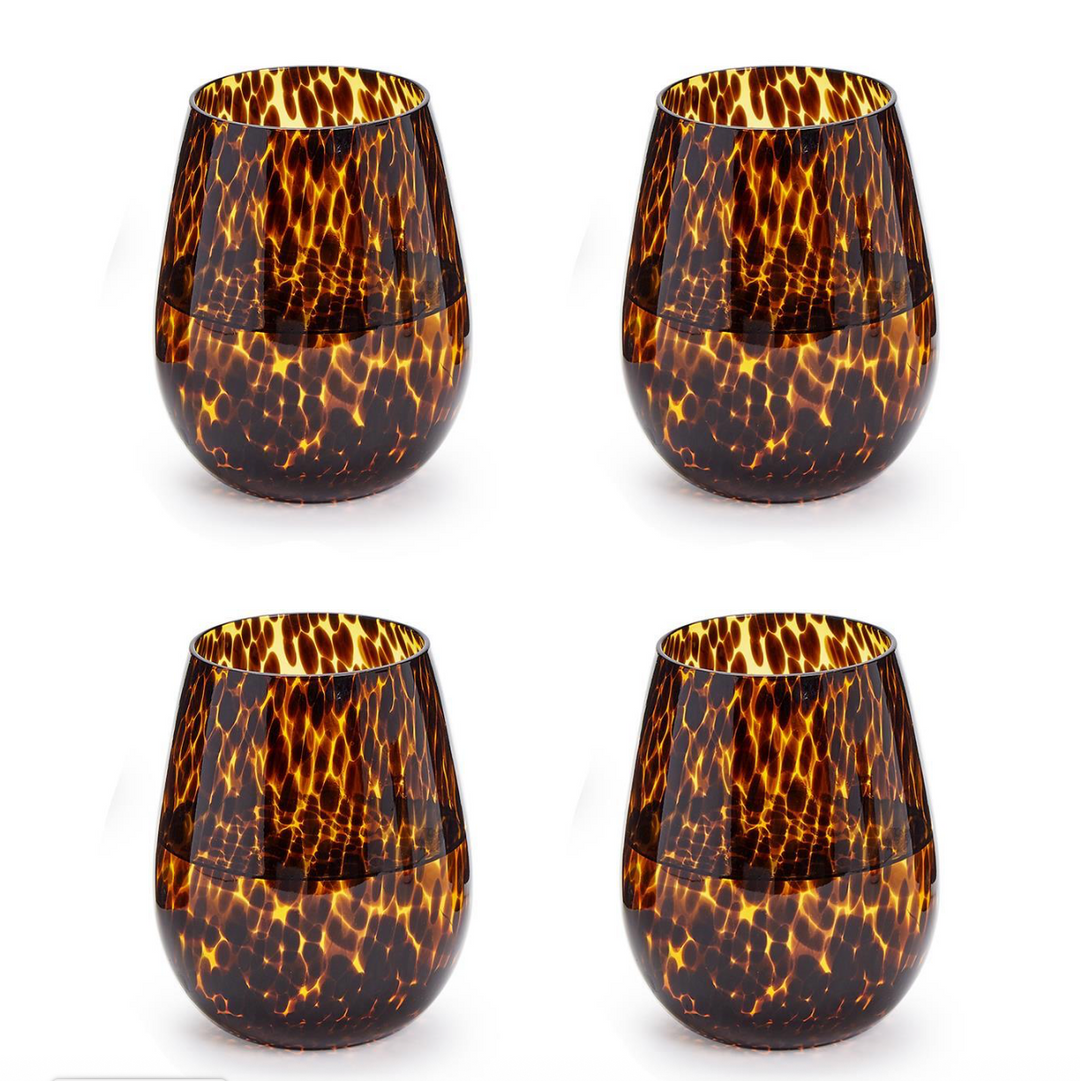 Four tortoiseshell patterned glasses on a white background