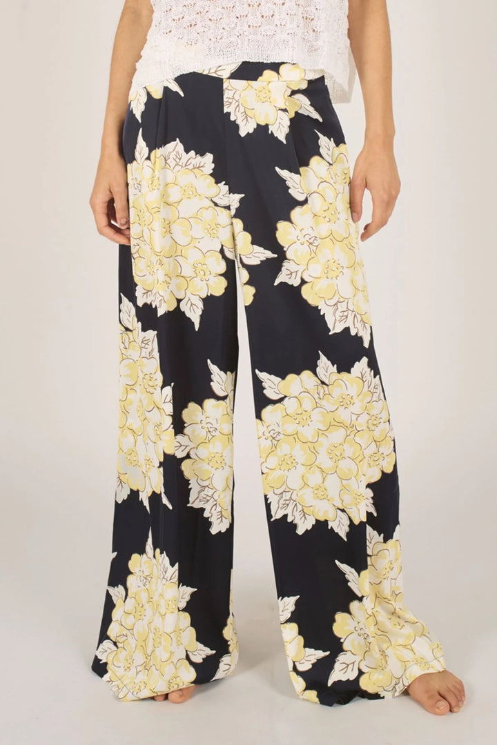 Traffic People Blooming Lovely trousers, stylish bottoms with floral print, featuring a comfortable fit and vibrant design.