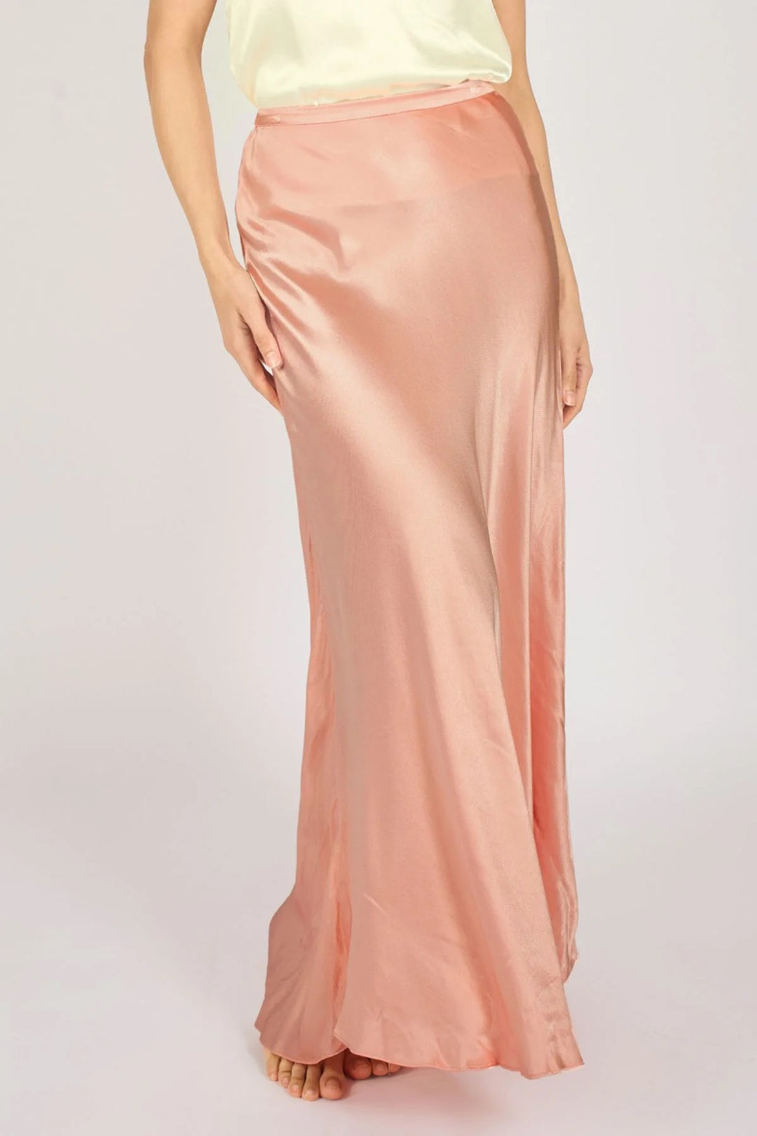 Traffic People Sade Pink Skirt, stylish pink skirt from the bottoms collection, shown on a hanger with a simple background.