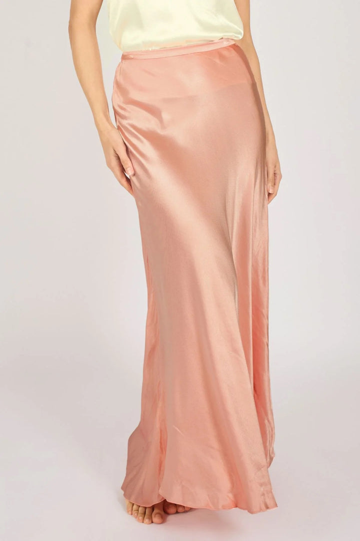 Traffic People Sade Pink Skirt, stylish pink skirt from the bottoms collection, shown on a hanger with a simple background.