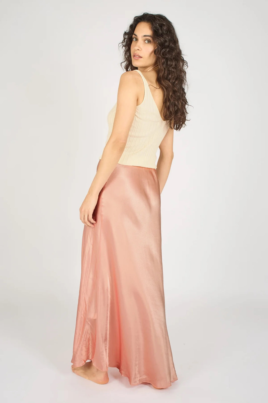 Pink Sade skirt from Traffic People, stylish bottoms with a flowy design, shown on a model against a neutral background.