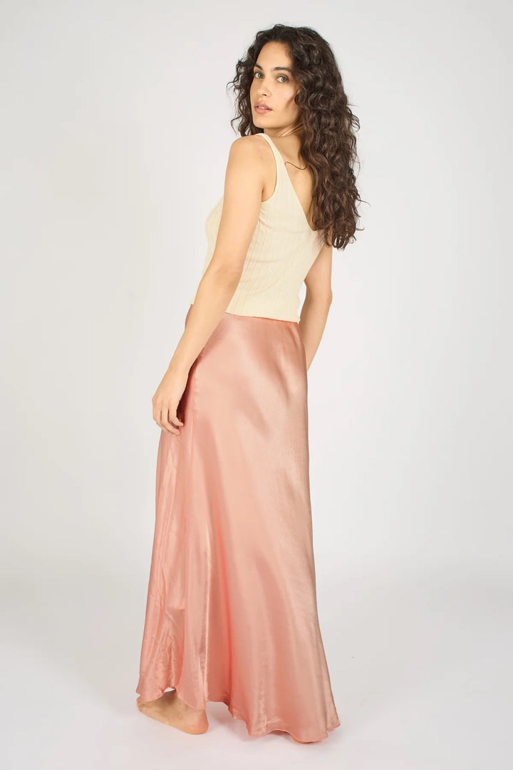 Pink Sade skirt from Traffic People, stylish bottoms with a flowy design, shown on a model against a neutral background.