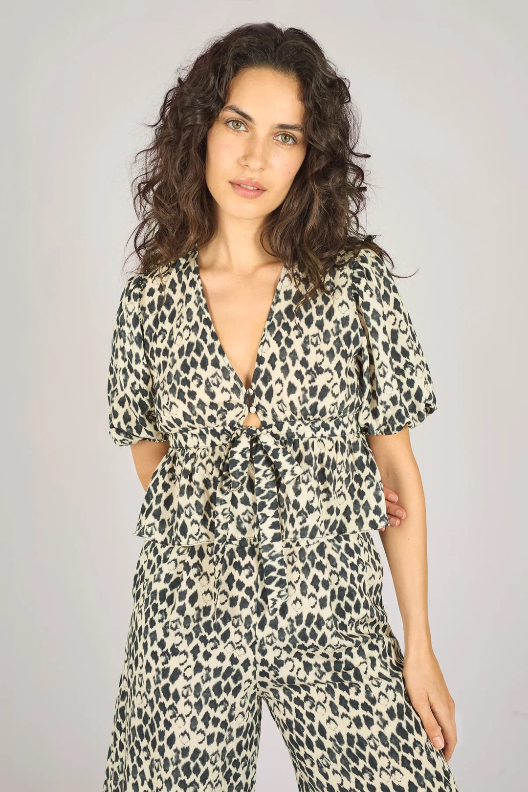 Traffic People Margot Black Print Top showing a stylish black patterned blouse with a relaxed fit and short sleeves.