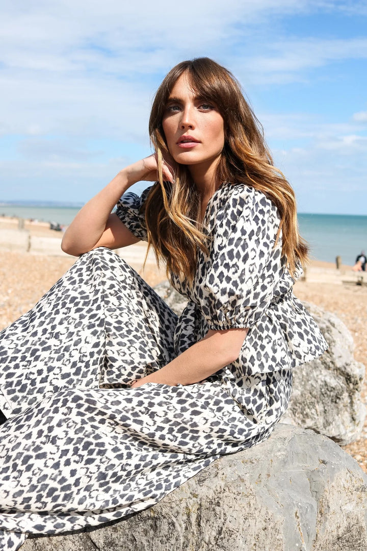Black print top from traffic People named Margot, featuring a stylish design and casual fit, perfect for everyday wear.