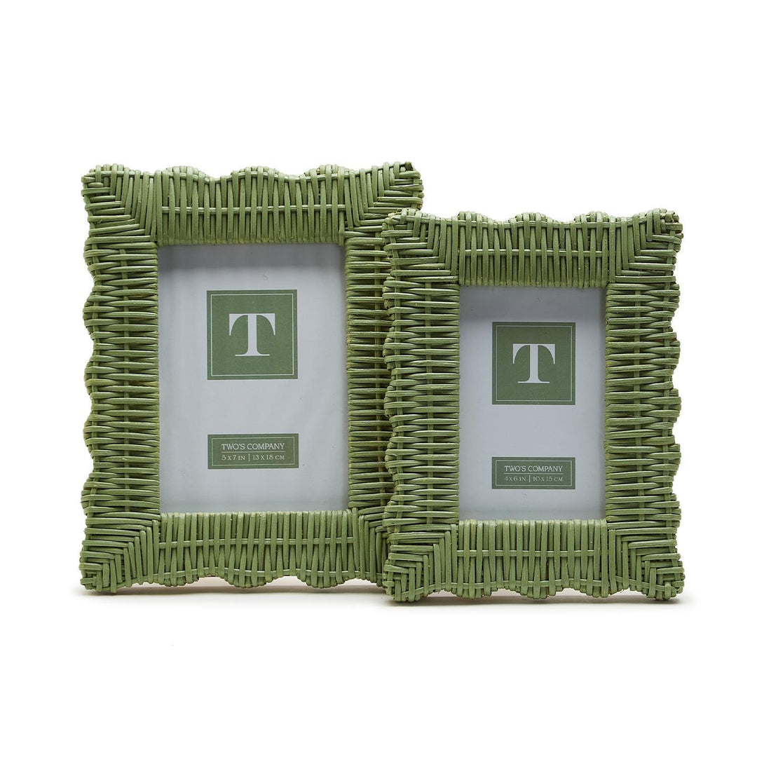 Green wicker frame for home decor by Two's Company, showing a stylish woven wicker design in a natural green finish.