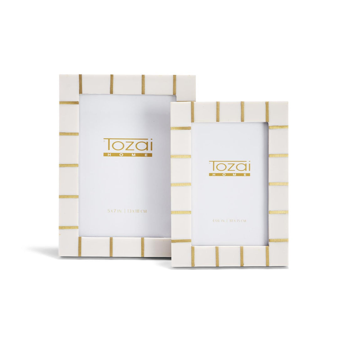 Ivory and brass lines frame for home decor by Two's Company, featuring modern geometric design and sleek metal accents.