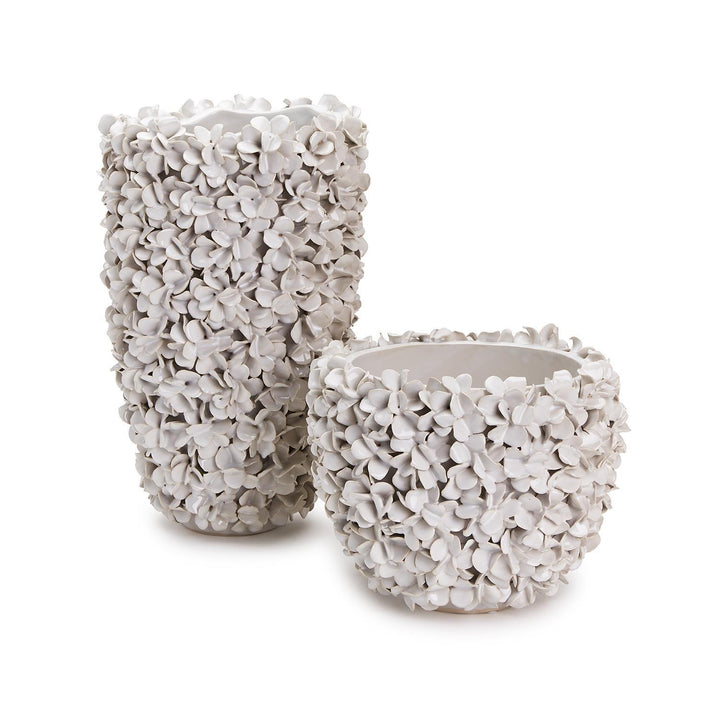 Two's Company Hydrangea planter with vibrant flowers in a stylish home vase on a wooden surface.