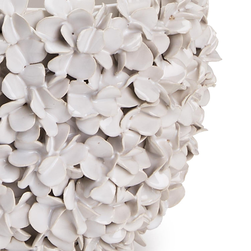 Hydrangea flowers in a decorative Two's Company home planter vase with a stylish design.