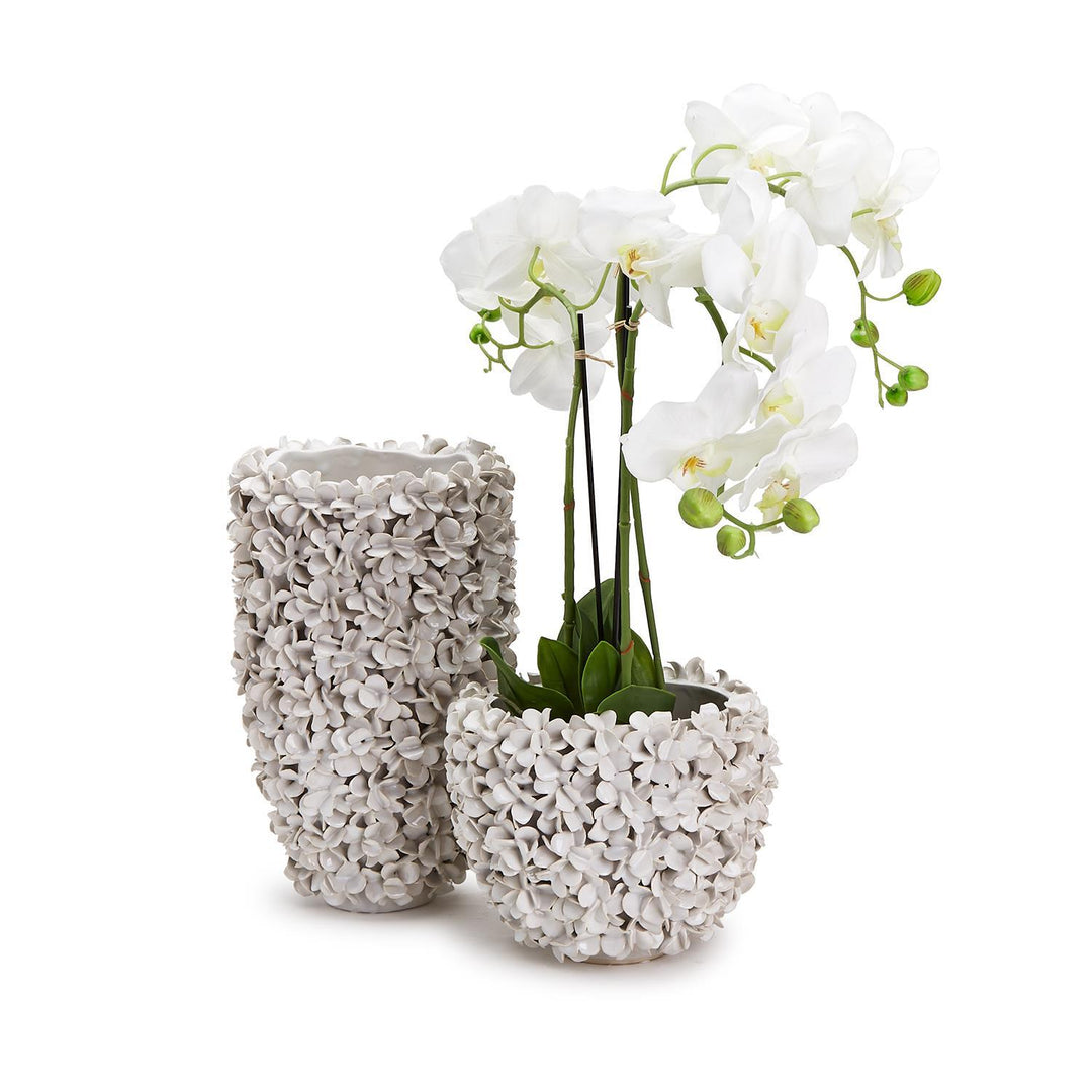 Hydrangea flowers in a Two's Company ceramic planter vase, home decor arrangement with lush blooms and greenery.