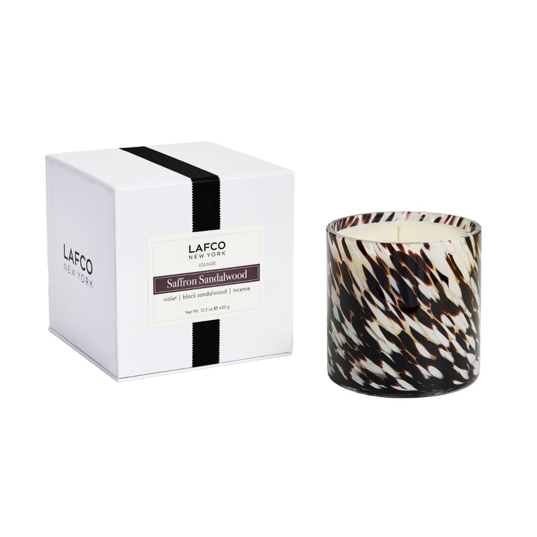 Lafco 15.5oz signature scented candle in a glass jar, elegant home decor with a lit wick and soft glow.