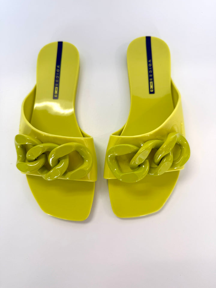 Voices Avolto Corrente Lime sandal with bright green straps, showcasing stylish accessory footwear on a neutral background.