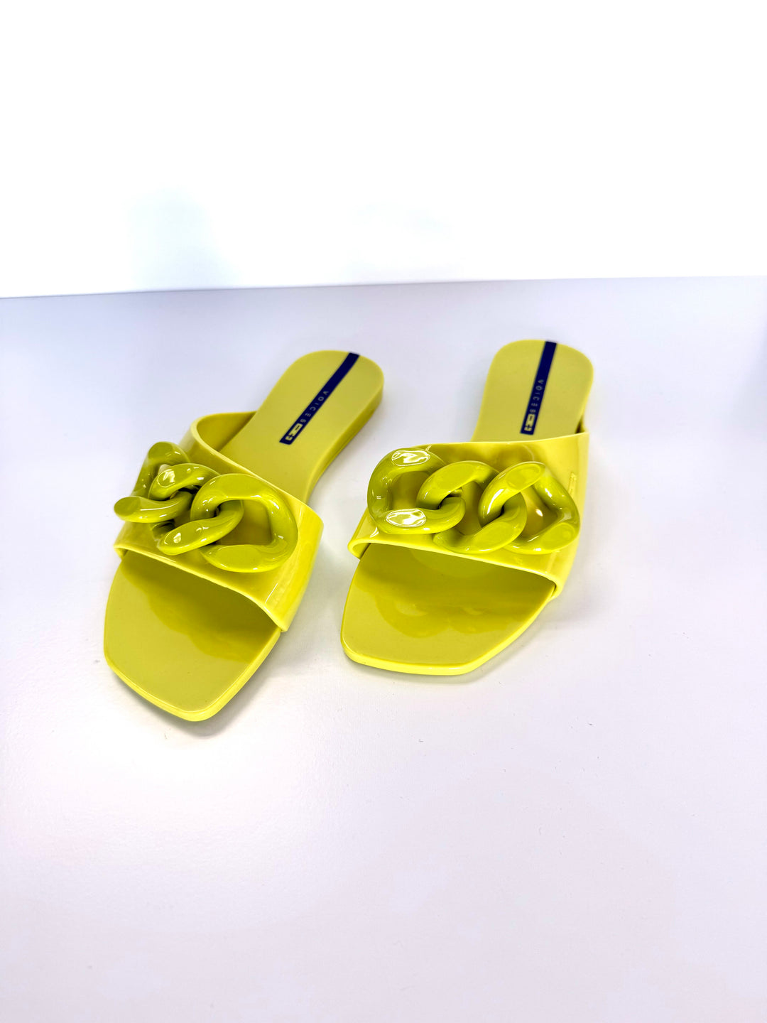 Voices Avolto Corrente Lime sandal accessory with adjustable straps and vibrant lime green color, designed for stylish footwear.