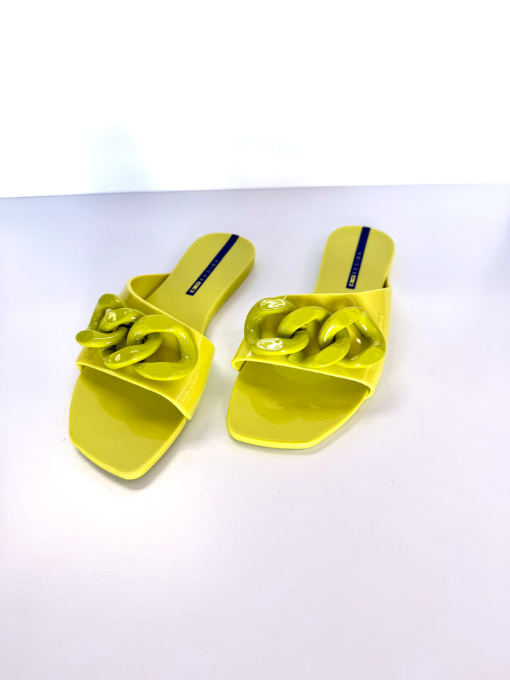 Voices Avolto Corrente Lime sandal accessory with adjustable straps and vibrant lime green color, designed for stylish footwear.