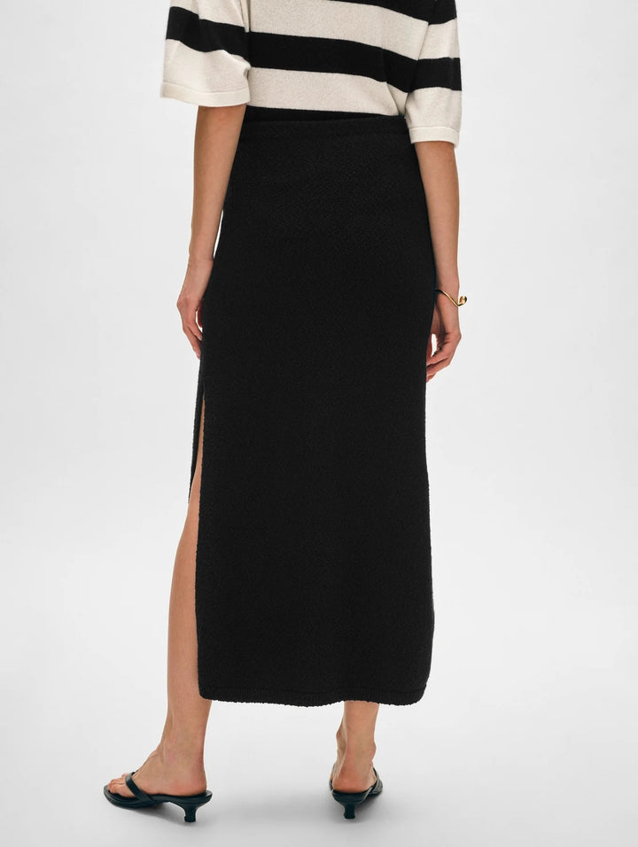 White & Warren cotton slub slit skirt, lightweight bottoms with side slit, styled on a model against a neutral background.