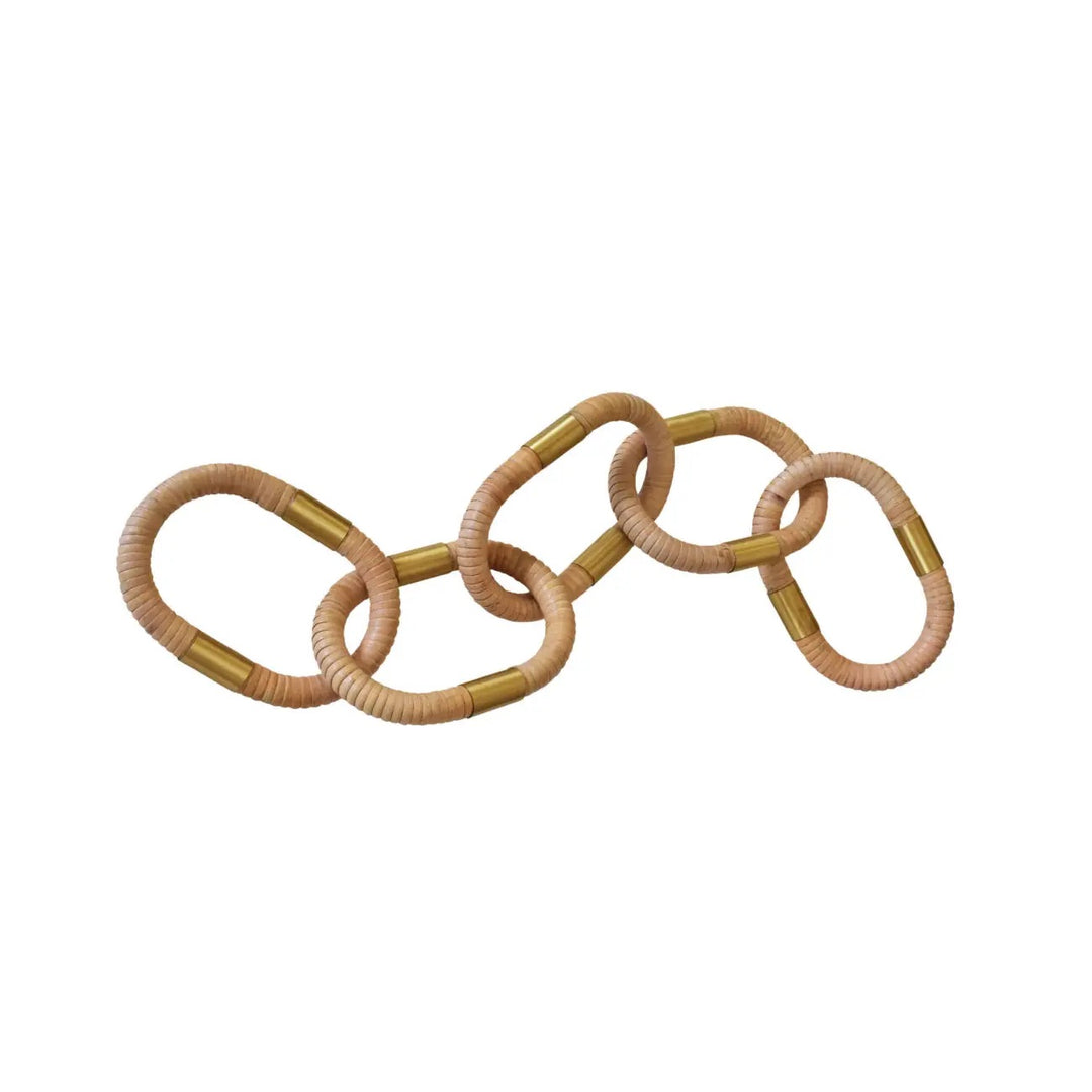 Oval rattan decorative chain for home decor by Worlds Away, showcasing intertwined rattan loops on a neutral background.