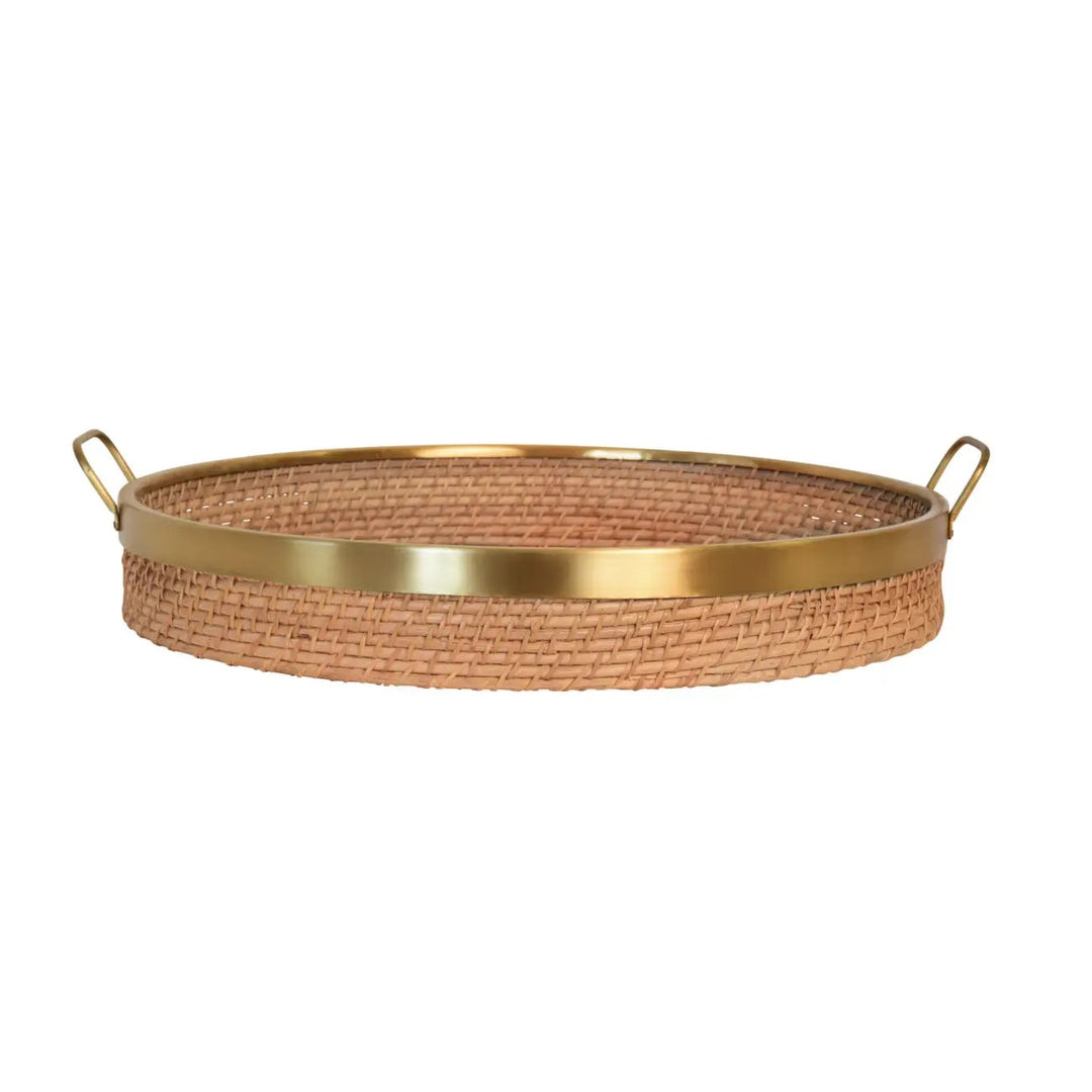Round rattan and brass tray for home decor, featuring a stylish natural rattan surface with brass handles and accents.