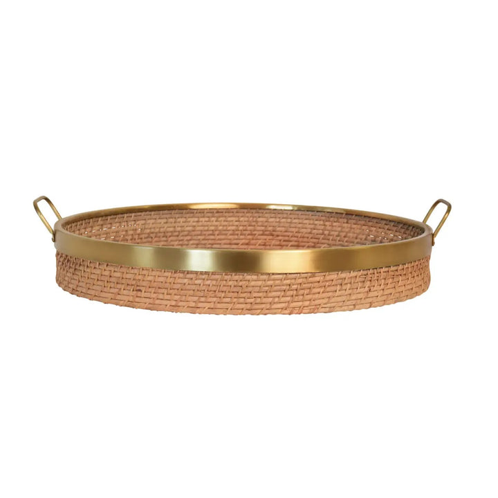 Round rattan and brass tray for home decor, featuring a stylish natural rattan surface with brass handles and accents.