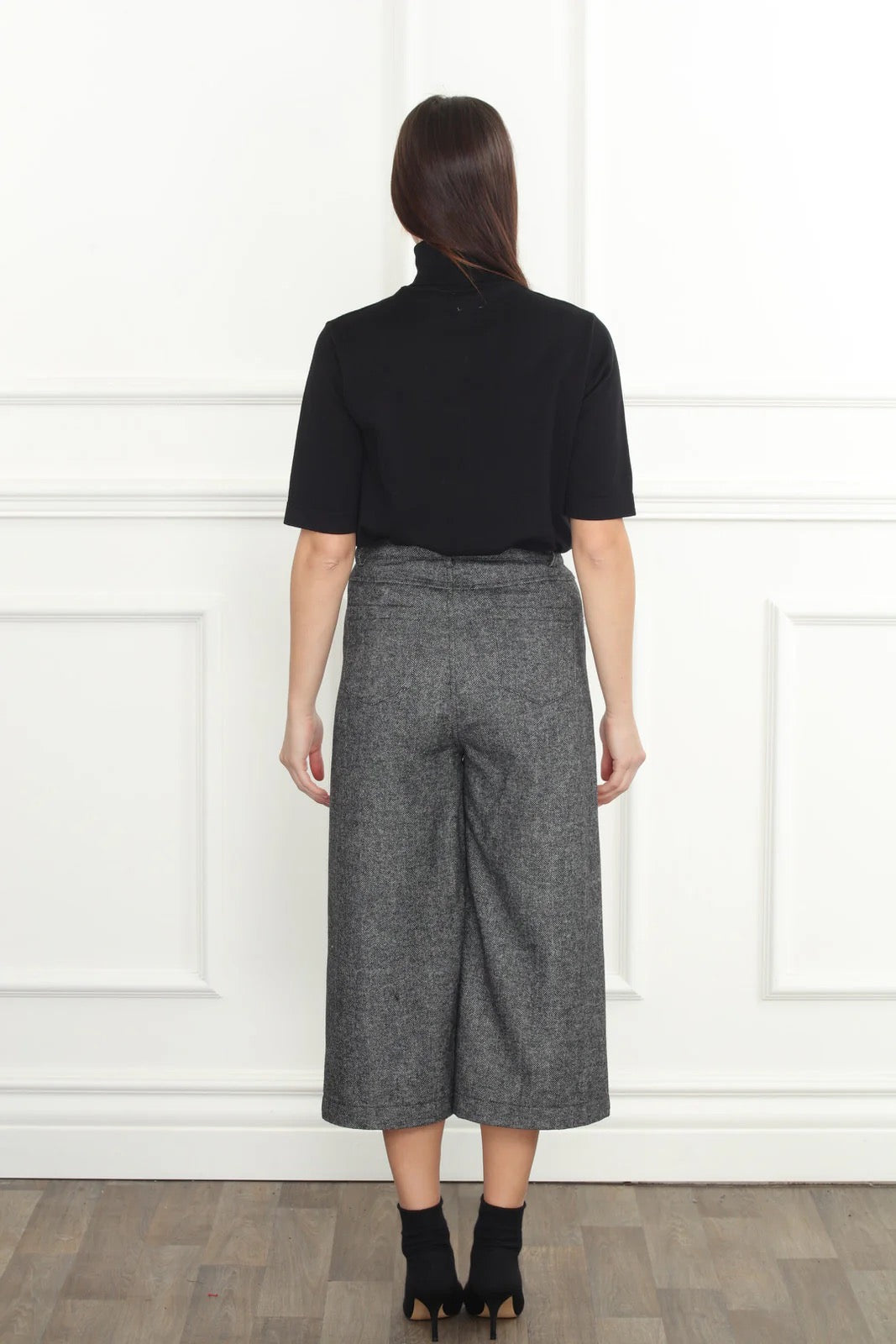 Herringbone crop pants from Zero Degrees Celsius Inc, stylish bottoms with a tailored fit and herringbone pattern.