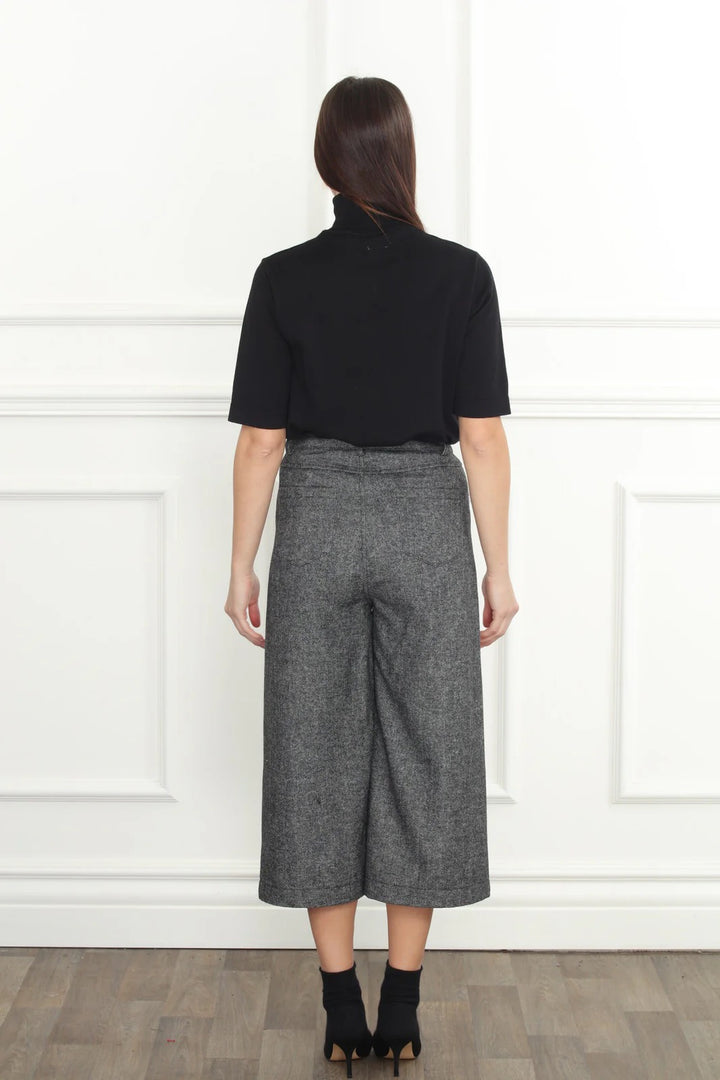 Herringbone crop pants from Zero Degrees Celsius Inc, stylish bottoms with a tailored fit and herringbone pattern.