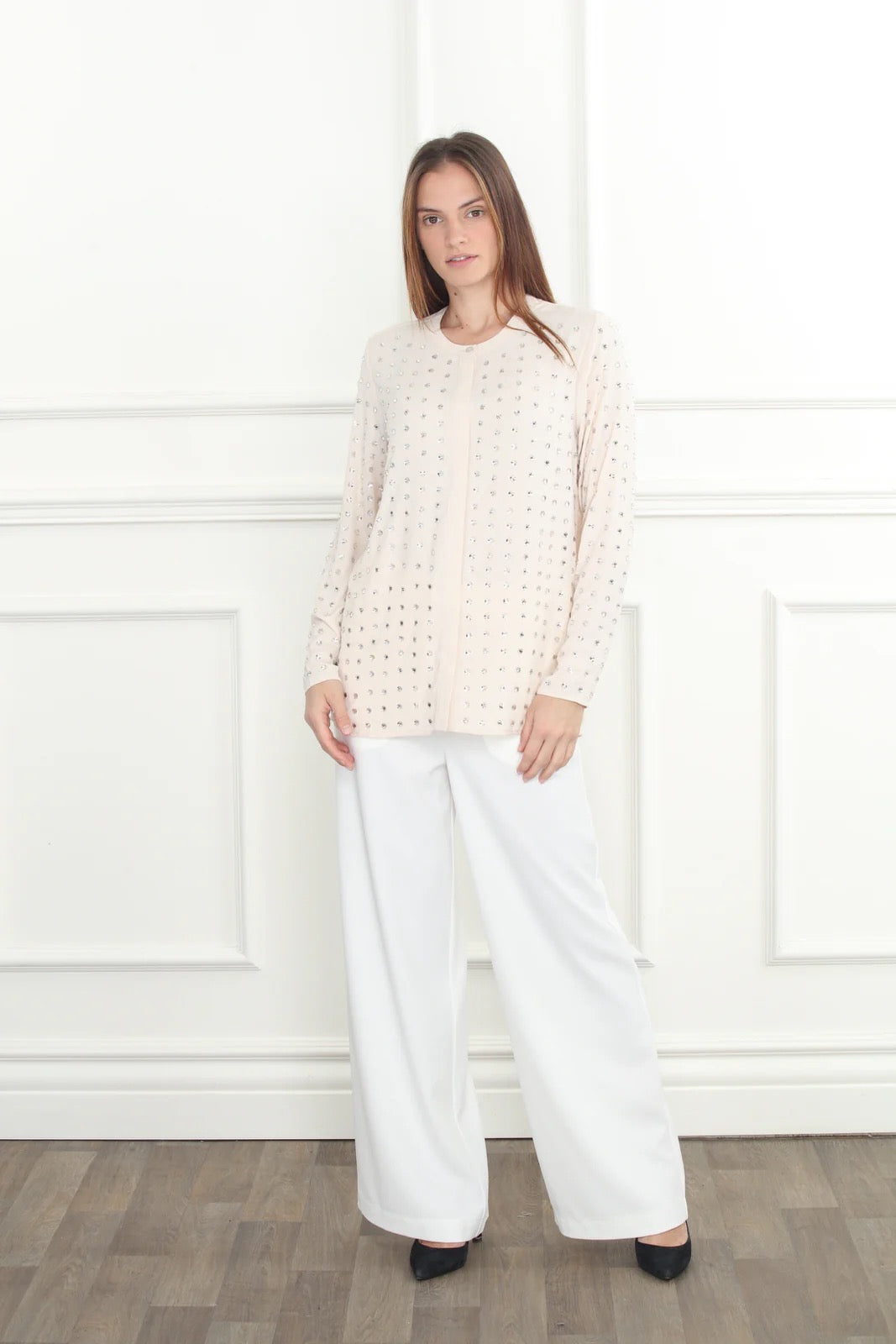 Wide leg trouser from Zero Degrees Celsius Inc featuring high-waisted, flowy bottoms with a relaxed fit and classic design.