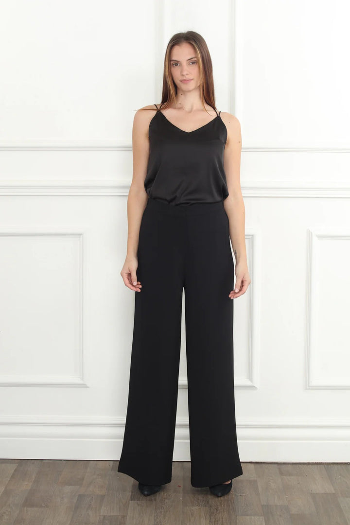Wide leg trousers from Zero Degrees Celsius Inc, stylish bottoms with a relaxed fit and flowing fabric, shown on a model.