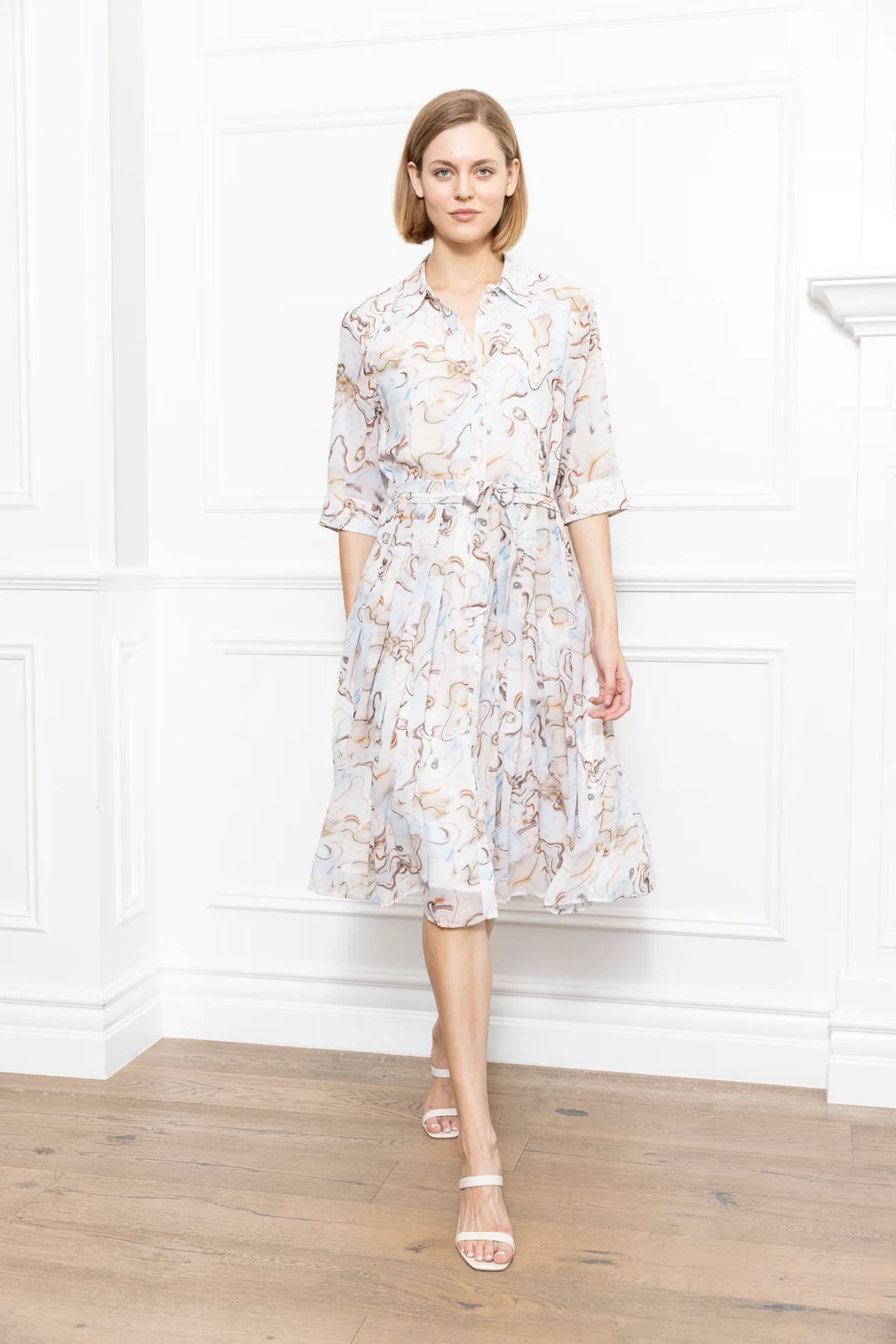 Marble print dress by Zero Degrees Celsius Inc featuring a stylish, flowing design with a fitted waist and sleeveless silhouette.