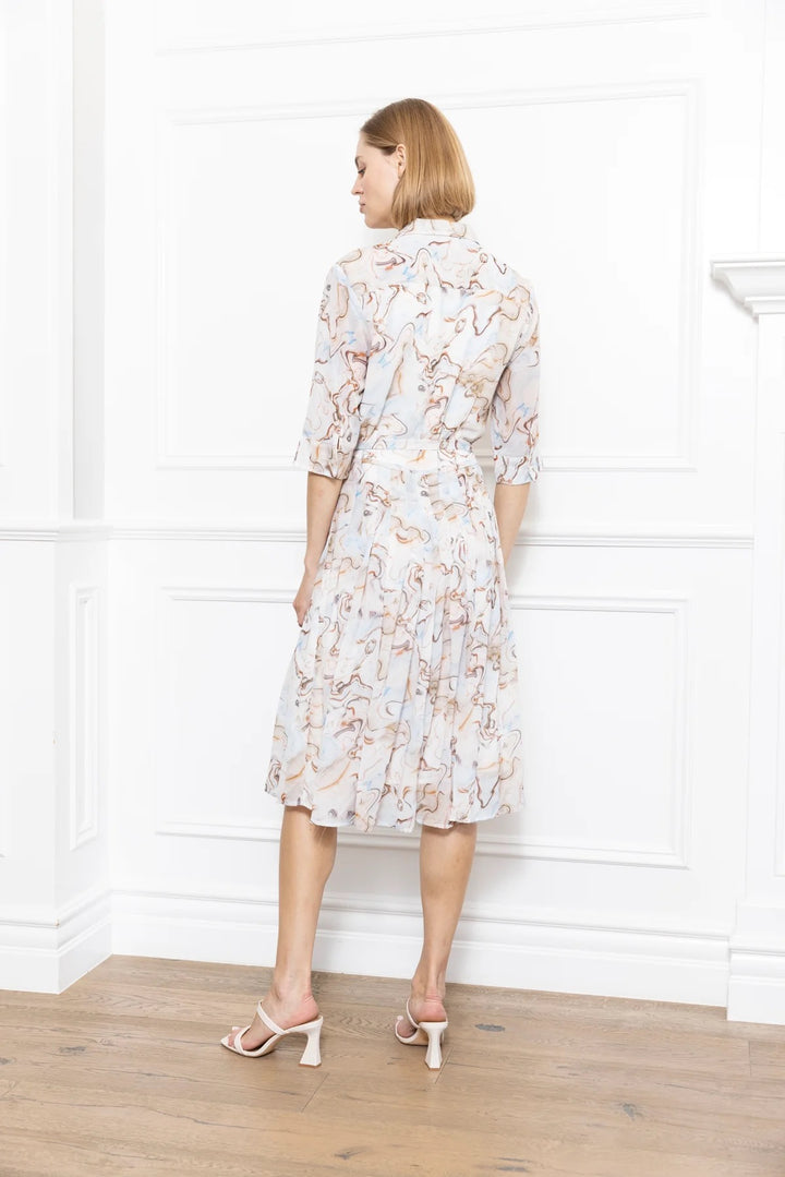 Marble print dress by Zero Degrees Celsius Inc, showcasing a stylish sleeveless dress with elegant marble pattern fabric.